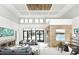 Elegant community lounge area with modern furnishings and a soaring ceiling at 231 Villa Domani Cir # 59, Davenport, FL 33896