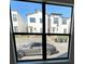 View from a window of modern townhomes and parked sports car at 231 Villa Domani Cir # 59, Davenport, FL 33896