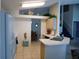 Bright kitchen area with stainless steel sink and view of the dining and living room at 3007 Bransbury Ct, Kissimmee, FL 34747