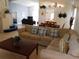 Bright and airy living room with large windows, comfortable seating, and tile floors at 3007 Bransbury Ct, Kissimmee, FL 34747