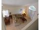 Upstairs view of the living room and dining area with lots of natural light and tile floors at 3007 Bransbury Ct, Kissimmee, FL 34747