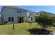 View of the backyard featuring green grass and backyard patio at 3600 Sagefield Dr, Harmony, FL 34773