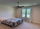 Bedroom with carpet, a ceiling fan, and a window with a view to the outdoors at 3600 Sagefield Dr, Harmony, FL 34773