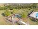 Aerial view featuring a community playground next to a sparkling pool at 3675 Cabo Ln, St Cloud, FL 34772
