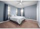 Light blue bedroom featuring carpet, and windows for natural light at 3675 Cabo Ln, St Cloud, FL 34772