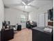 Bedroom with a ceiling fan, large desks, and a window allowing natural light at 3675 Cabo Ln, St Cloud, FL 34772