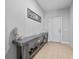Inviting entryway with stylish console table, decor and easy access to front door at 3675 Cabo Ln, St Cloud, FL 34772