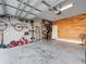 Spacious garage with ample storage, work space, and a painted brick wall at 3675 Cabo Ln, St Cloud, FL 34772