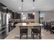 Bright kitchen with granite countertops, stainless steel appliances, and dining area at 3675 Cabo Ln, St Cloud, FL 34772