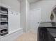 Functional mud room featuring a bench, storage cubbies, and tile flooring at 3675 Cabo Ln, St Cloud, FL 34772