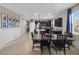 Open-concept floorplan showcases a dining area connecting to a kitchen with modern finishes at 3675 Cabo Ln, St Cloud, FL 34772