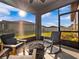 Relaxing screened porch overlooking the backyard, complete with rocking chairs and a fire pit at 3675 Cabo Ln, St Cloud, FL 34772