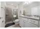 Stylish bathroom with a glass-enclosed shower, modern fixtures, and vanity at 4002 Lana Ave, Davenport, FL 33897