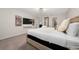 Bright bedroom featuring a cozy king bed, modern lighting, and a flat screen television at 4002 Lana Ave, Davenport, FL 33897