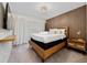 Modern bedroom with platform bed, wood slat accent wall, and decorative lighting at 4002 Lana Ave, Davenport, FL 33897