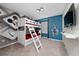 Themed bunk bedroom with a playful Mickey Mouse mural and a wall-mounted TV at 4002 Lana Ave, Davenport, FL 33897