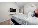 Cozy bedroom features comfortable bedding and a wall-mounted TV for a relaxing retreat at 4002 Lana Ave, Davenport, FL 33897