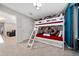 Themed bunk bedroom features a twin over twin bunk, red bedding, and a closet at 4002 Lana Ave, Davenport, FL 33897