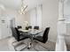 Contemporary dining room with seating for six and modern chandelier and a view of the side yard at 4002 Lana Ave, Davenport, FL 33897