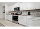 Well-lit kitchen featuring stainless steel appliances, granite countertops, and subway tile backsplash at 4002 Lana Ave, Davenport, FL 33897