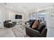 Modern living room with leather furniture, decorative lighting, and sliding glass doors to the pool at 4002 Lana Ave, Davenport, FL 33897