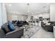 Open concept living space with dining area, kitchen, and comfortable seating at 4002 Lana Ave, Davenport, FL 33897