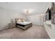 Spacious main bedroom with king bed, decorative wallpaper, and ensuite bathroom at 4002 Lana Ave, Davenport, FL 33897