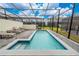 Private screened-in pool and spa with lounge seating and manicured backyard at 4002 Lana Ave, Davenport, FL 33897