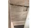 Nicely tiled bathtub and shower with decorative tile accents and built in storage at 414 Dakota Ave, St Cloud, FL 34769