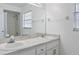 Bright bathroom with double sinks, a large mirror, and a shower/tub combination at 4531 Lake Trudy Dr, St Cloud, FL 34769