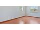 Bright bedroom features natural light, hardwood floors and neutral walls at 4531 Lake Trudy Dr, St Cloud, FL 34769