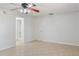 Bright and spacious bedroom features tile floors and ceiling fan with access to bathroom at 4531 Lake Trudy Dr, St Cloud, FL 34769