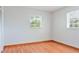 Clean, bright bedroom offers hardwood floors and two sunny windows at 4531 Lake Trudy Dr, St Cloud, FL 34769
