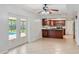 Open-concept kitchen featuring rich wood cabinets, tile backsplash, and stainless steel appliances at 4531 Lake Trudy Dr, St Cloud, FL 34769