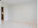 An empty living room features tile floors, neutral walls, and a doorway leading to another room at 4531 Lake Trudy Dr, St Cloud, FL 34769