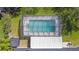 Aerial view of screened pool with refreshing, clear water, and a small storage shed nearby at 4531 Lake Trudy Dr, St Cloud, FL 34769