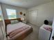 Cozy bedroom featuring a large window and a spacious closet at 474 Annabelle Way, Davenport, FL 33837