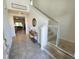 Inviting entryway with staircase, tile floors and accent table at 474 Annabelle Way, Davenport, FL 33837