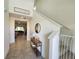 Inviting foyer with tile flooring, high ceilings, and staircase leading to the second floor at 474 Annabelle Way, Davenport, FL 33837