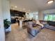 Open-concept living space combining living room, kitchen and dining area with plenty of space to entertain at 474 Annabelle Way, Davenport, FL 33837