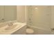Bathroom with a shower/tub combination, sink, and toilet at 4881 Vellacito Way, Davenport, FL 33897