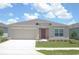 Charming single-story home with manicured lawn and neutral-colored exterior at 4881 Vellacito Way, Davenport, FL 33897