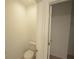Toilet room features a toilet and access to a walk in closet or bedroom at 4881 Vellacito Way, Davenport, FL 33897