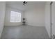 Bedroom with tiled floor, white walls, window with shades and a small table with plant at 4952 Shady Pines Dr, St Cloud, FL 34772