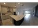 Modern kitchen with stainless steel appliances, center island, and tile backsplash at 4952 Shady Pines Dr, St Cloud, FL 34772