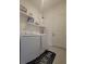 Laundry room with modern appliances, sink, and storage cabinets at 4952 Shady Pines Dr, St Cloud, FL 34772