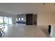 Open-concept living room featuring a fireplace, accent wall, and tile flooring at 4952 Shady Pines Dr, St Cloud, FL 34772