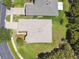 Aerial view of a home with a gray roof and a green yard and neighboring home at 531 Barcelona Dr, Poinciana, FL 34759