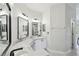 Primary bathroom featuring double vanity, granite counter tops, new hardware, and modern lighting at 531 Barcelona Dr, Poinciana, FL 34759