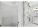 Bathroom walk-in closet with an additional barn door leading to bathroom featuring new hardware and lighting at 531 Barcelona Dr, Poinciana, FL 34759